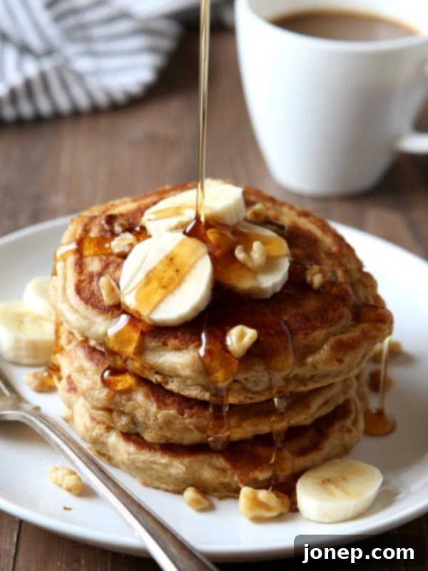 Stack of warm Whole Wheat Banana Nut Pancakes ready to be served