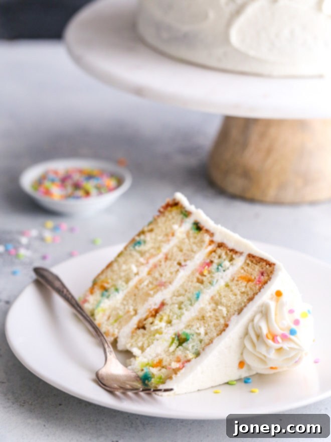 This funfetti cake made with light and buttery vanilla cake layers studded with rainbow sprinkles and fluffy vanilla buttercream frosting is such a fun and cheerful dessert!