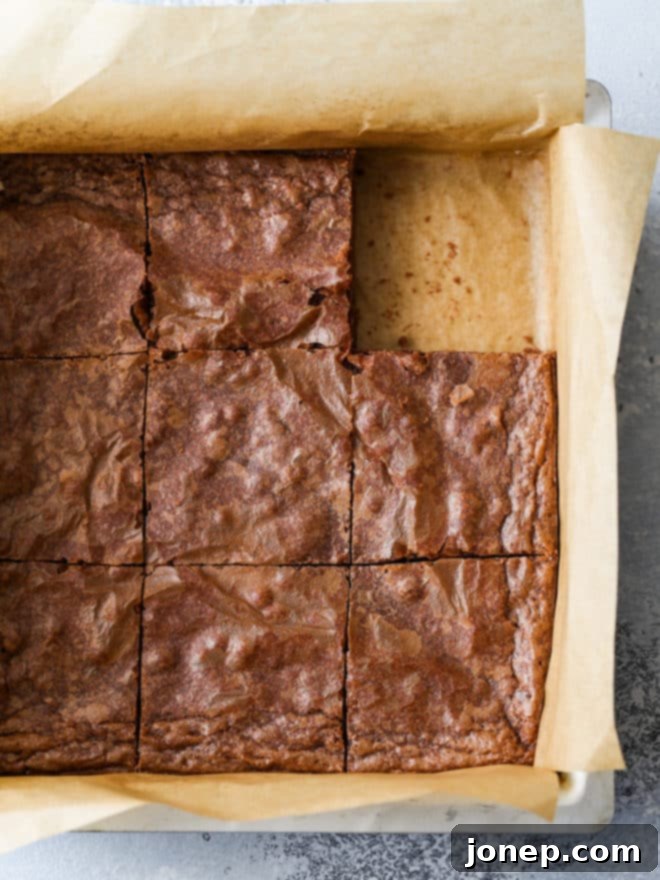 another view of classic fudge brownies being cut in the pan