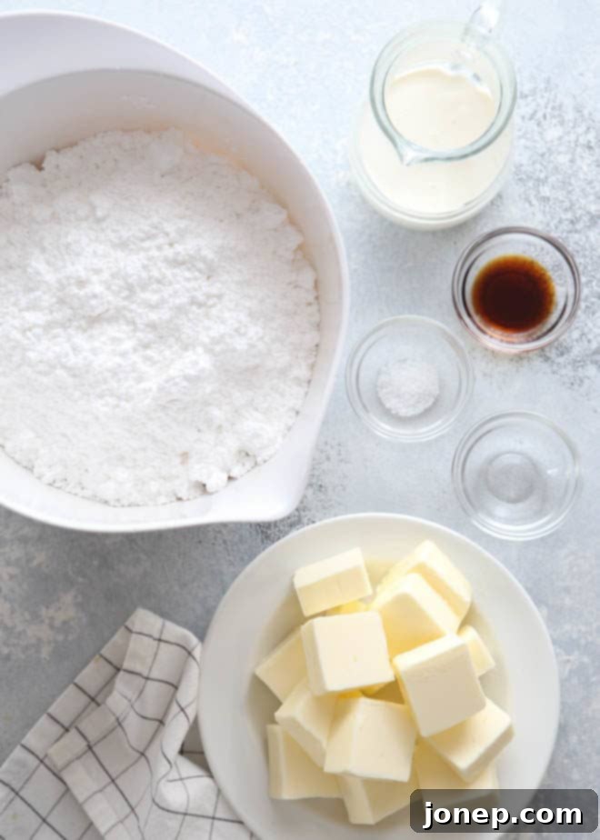 Vanilla Bean Dream Frosting 3 Essential ingredients laid out for making the best whipped vanilla buttercream frosting.