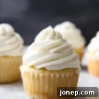 Vanilla Bean Dream Frosting 7 The fluffiest and creamiest vanilla frosting, piled on a cupcake, as featured in this recipe.