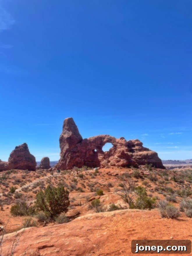 Family enjoying rock scrambling in Moab