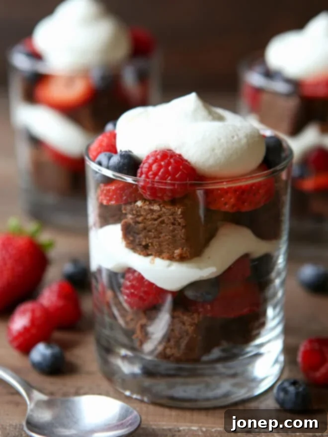 Decadent Brownie Berry Delight 6 closeup of brownie berry trifles with a spoon