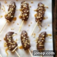 Caramel Walnut Crunch Chocolate Dipped Frozen Bananas 2 Chocolate Covered Frozen Bananas with Salted Caramel and Walnuts | completelydelicious.com