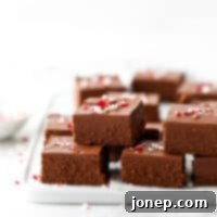 Decadent Peppermint Fudge 8 lots of peppermint fudge stacked on a plate