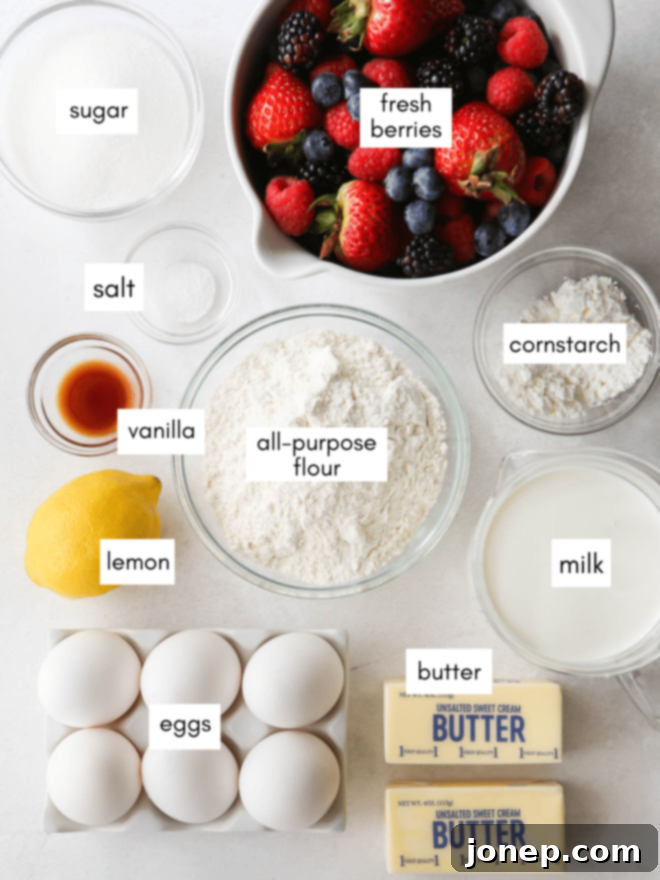 Zesty Lemon Berry Tart 4 A flat lay photograph showcasing the key ingredients for a Lemon Berry Tart: flour, sugar, butter, lemons, eggs, and a selection of fresh mixed berries.