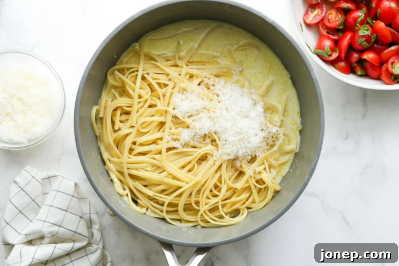 adding pasta to sauce in pot