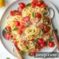 Bright Lemon Tomato Basil Pasta 9 lemon pasta with tomatoes and basil on a plate in utensils
