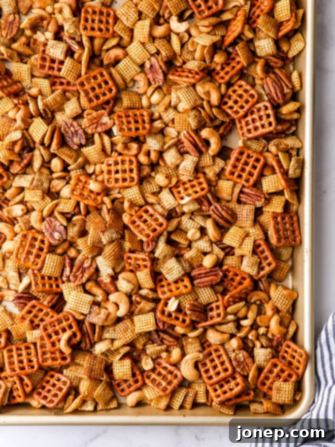 Sweet Maple Nut Medley 6 Baked maple nut snack mix cooling on a baking pan