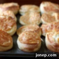 Golden brown cheese popovers, ready to be enjoyed