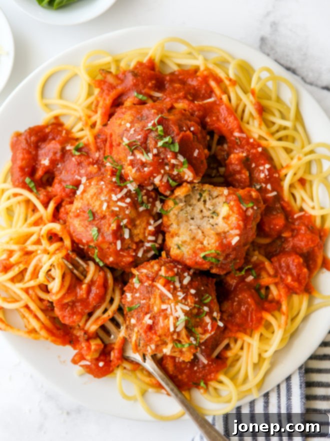 Garden Fresh Turkey Zucchini Meatballs 2 Plate of turkey zucchini meatballs served over spaghetti