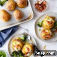 One-Pan Loaded Baked Potatoes 9 plating baked potato servings with toppings and sheet pan in the corner