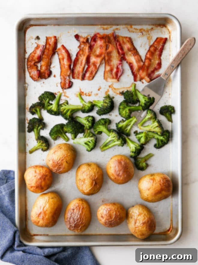 One-Pan Loaded Baked Potatoes 3 Baked potato sheet pan dinner done and ready for toppings, showing golden potatoes, crispy bacon, and vibrant green broccoli.