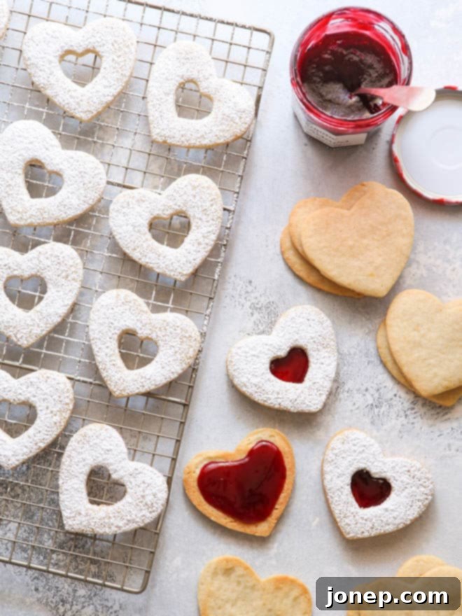 Classic Raspberry Almond Linzer Cookies 7 Assembled Raspberry Almond Linzer Cookies with jam filling visible