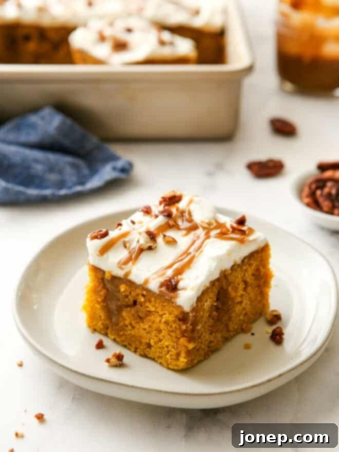 Decadent Pumpkin Caramel Infusion Cake 2 slice of pumpkin caramel poke cake on plate