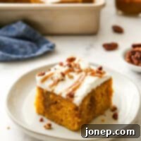 Decadent Pumpkin Caramel Infusion Cake 11 slice of pumpkin caramel poke cake on plate