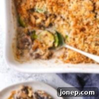Savory Brussels Sprouts and Mushroom Gratin 8 scooping brussels sprout and mushroom casserole out of baking dish