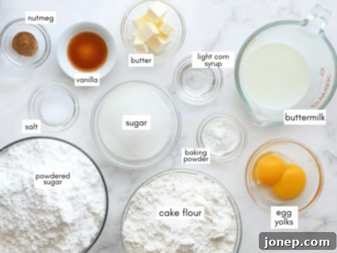 Ingredients laid out for old-fashioned doughnuts, including flour, sugar, eggs, buttermilk, and spices.
