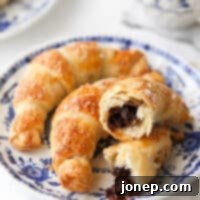 closeup of puff pastry chocolate croissants on a plate