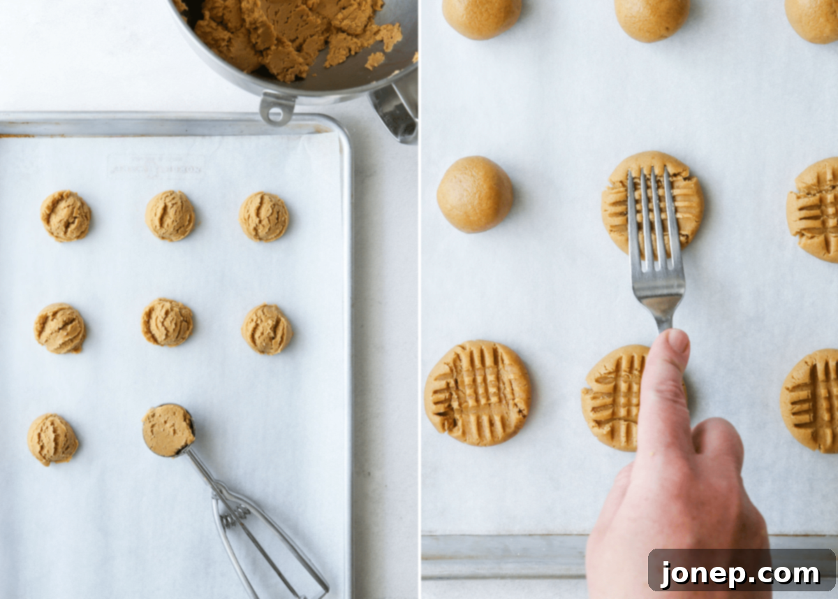 Raw cookie dough balls with classic crisscross fork marks on a parchment-lined baking sheet, ready for baking.