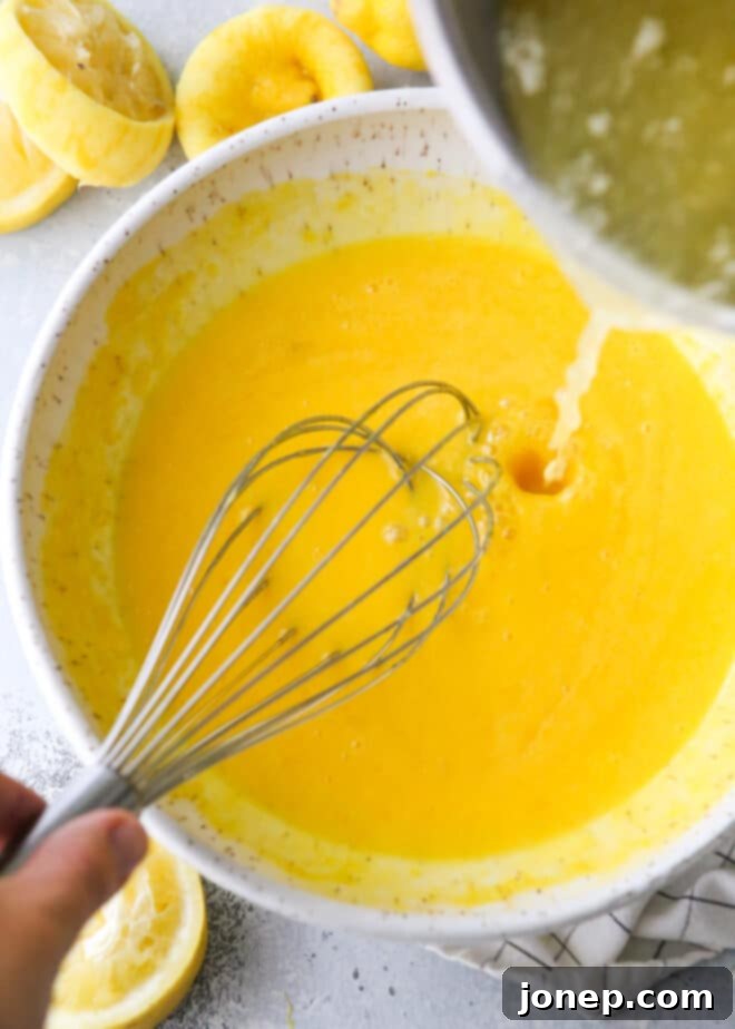 Delicious Homemade Lemon Curd 4 tempering liquids into egg yolks