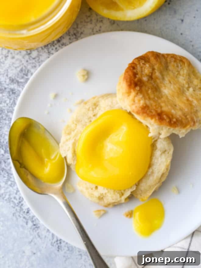 Delicious Homemade Lemon Curd 7 lemon curd on a biscuit