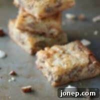 A delicious White Chocolate Brownie with Pecans, beautifully presented.