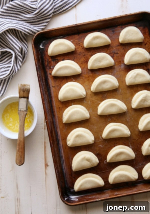 Warm Parker House Rolls brushed with melted butter