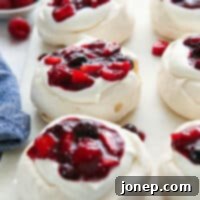 Vibrant Berry Cloud Pavlova 9 close up of mini berry pavlovas on a serving platter