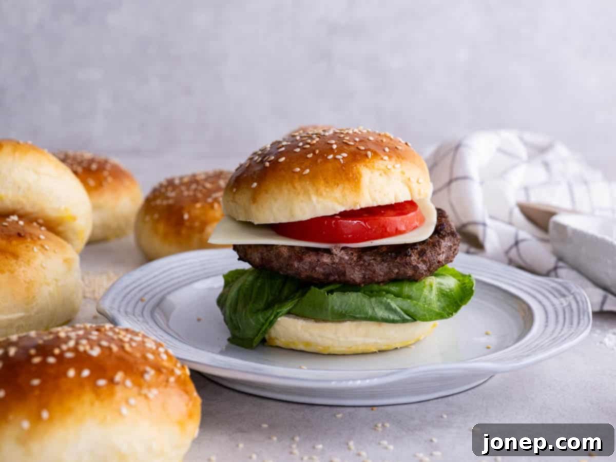 assembled burger with a juicy patty and fresh toppings on a homemade brioche bun