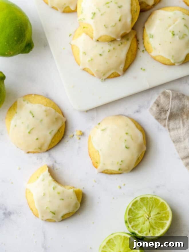 Zesty Lime Cornmeal Delights 2 View of lime cornmeal cookies arranged beautifully on a table, showcasing their golden hue and zesty glaze
