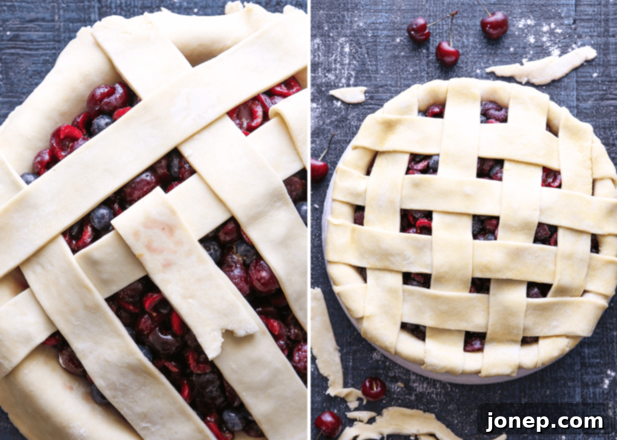 A sweet cherry pie being prepared, showing the lattice crust being woven on top of the cherry filling, ready for baking.