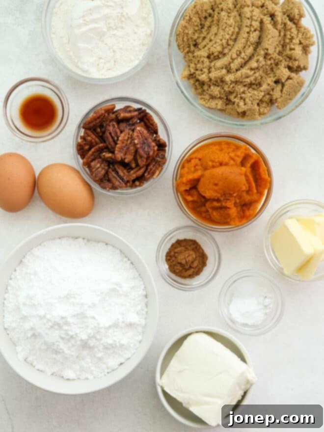 Classic Pumpkin Roll 4 pumpkin roll ingredients measured out on a counter