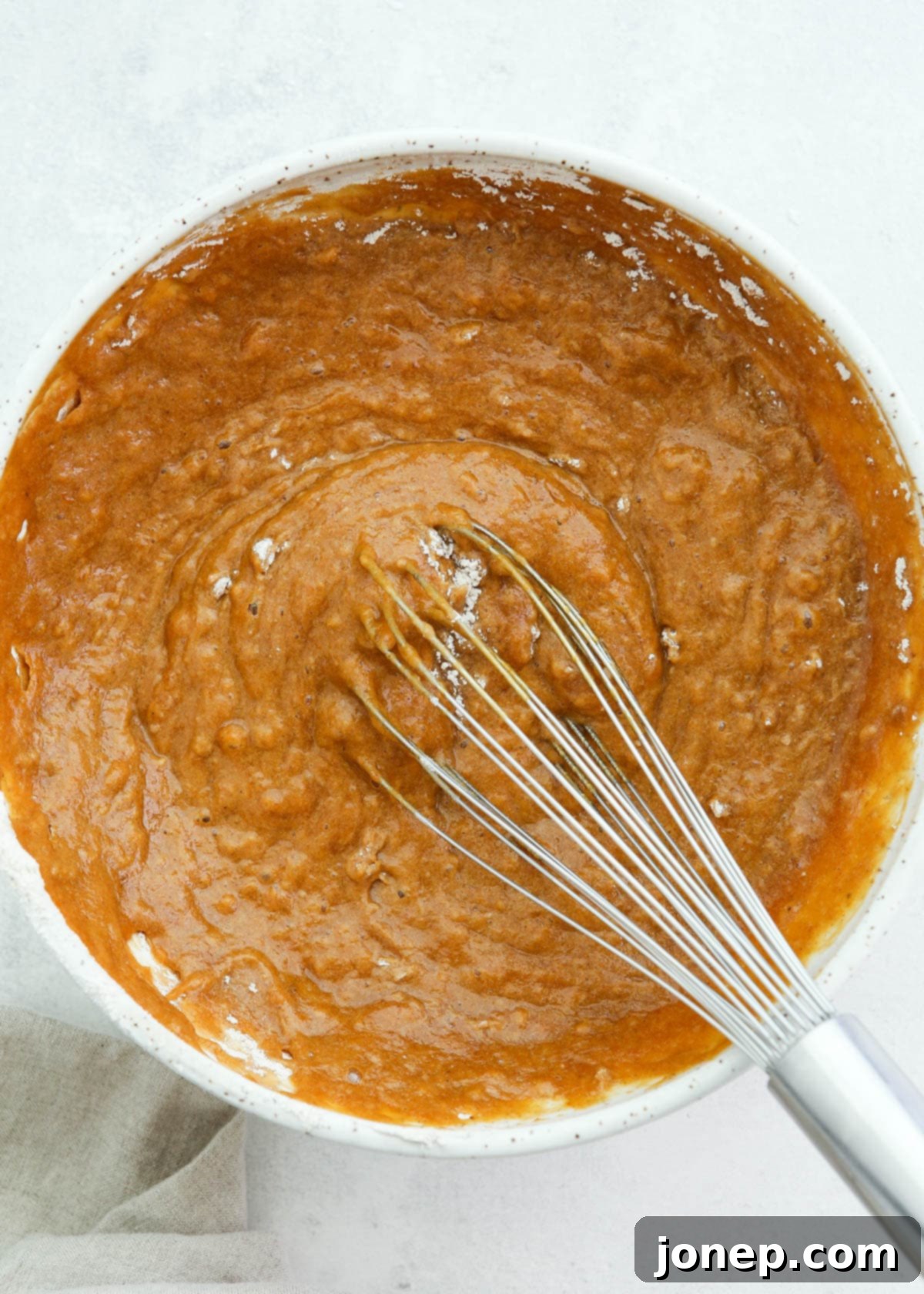 Classic Pumpkin Roll 5 mixing pumpkin roll cake batter in bowl until smooth