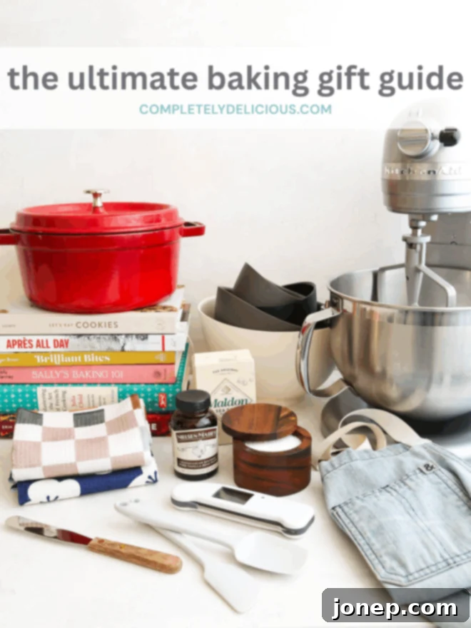 Baking Gift Guide: Equip The Ultimate Baker 4 A selection of baking tools and ingredients, including a stand mixer, measuring cups, flour, and sugar, arranged beautifully on a countertop.