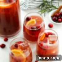 holiday punch in individual glasses with pitcher in background