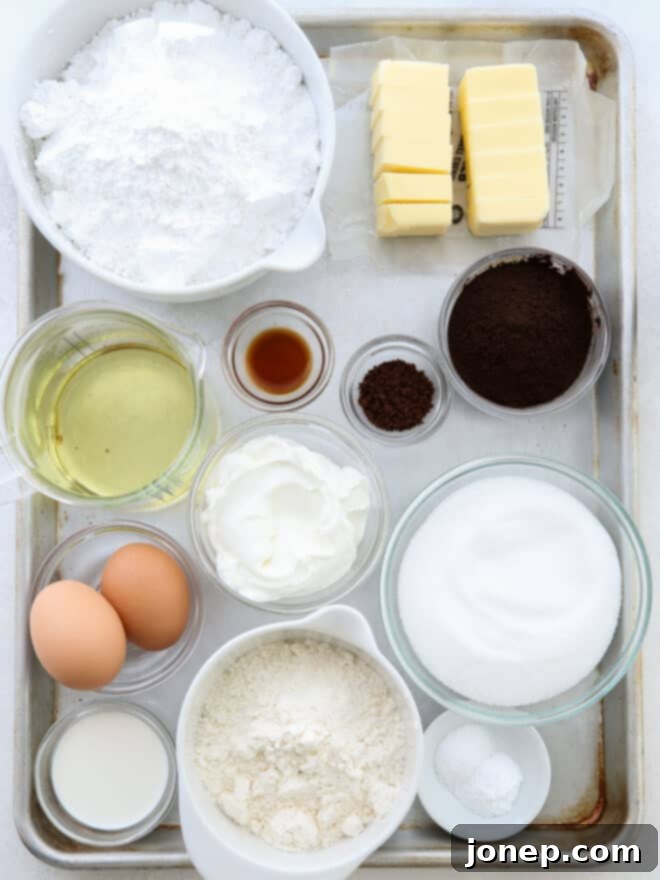 Oreo Bliss Bites 4 All the essential ingredients for making Oreo cupcakes, beautifully arranged.