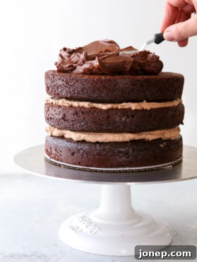 Ten Steps to Cake-Baking Bliss 4 Expertly frosting a rich and decadent chocolate sour cream cake