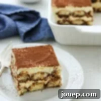 Timeless Italian Tiramisu 10 Slice of classic Italian Tiramisu on a plate, ready to eat!